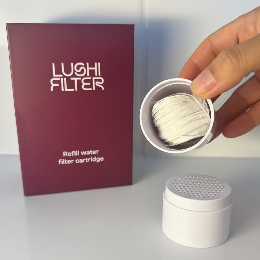 Lushi Filter refill water filter cartridge with packaging on a marble surface